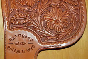 Tooled leather Floral stamped leather. Stamp reads, "G.K. Fraker, Maker, Buffalo WYO"